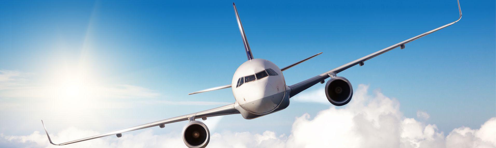 Front view of a commercial plane in flight