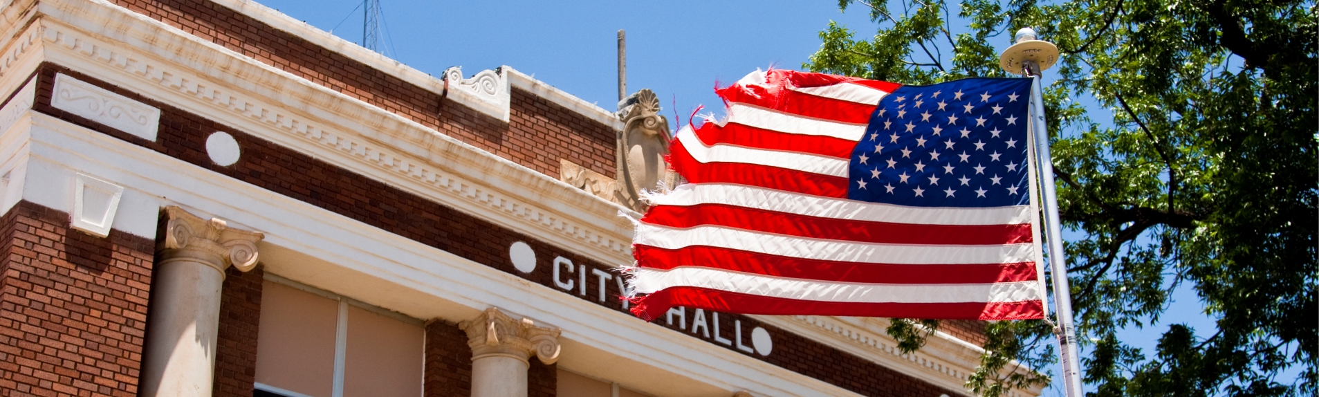 American flag displayed outside a city hall