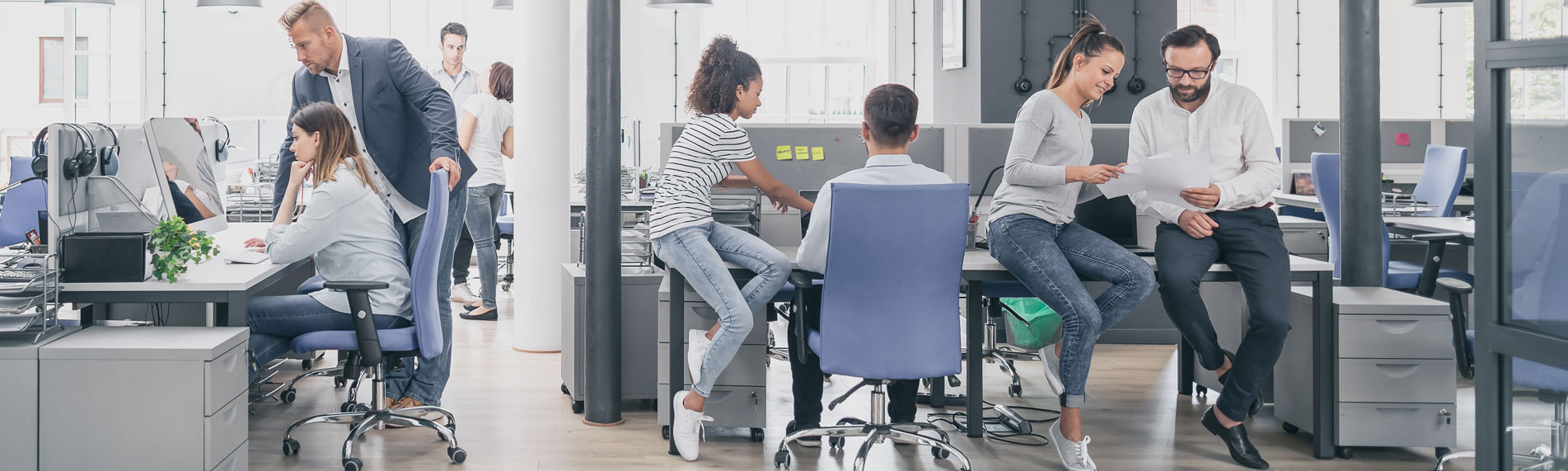 Open office space with multiple people interacting with each other