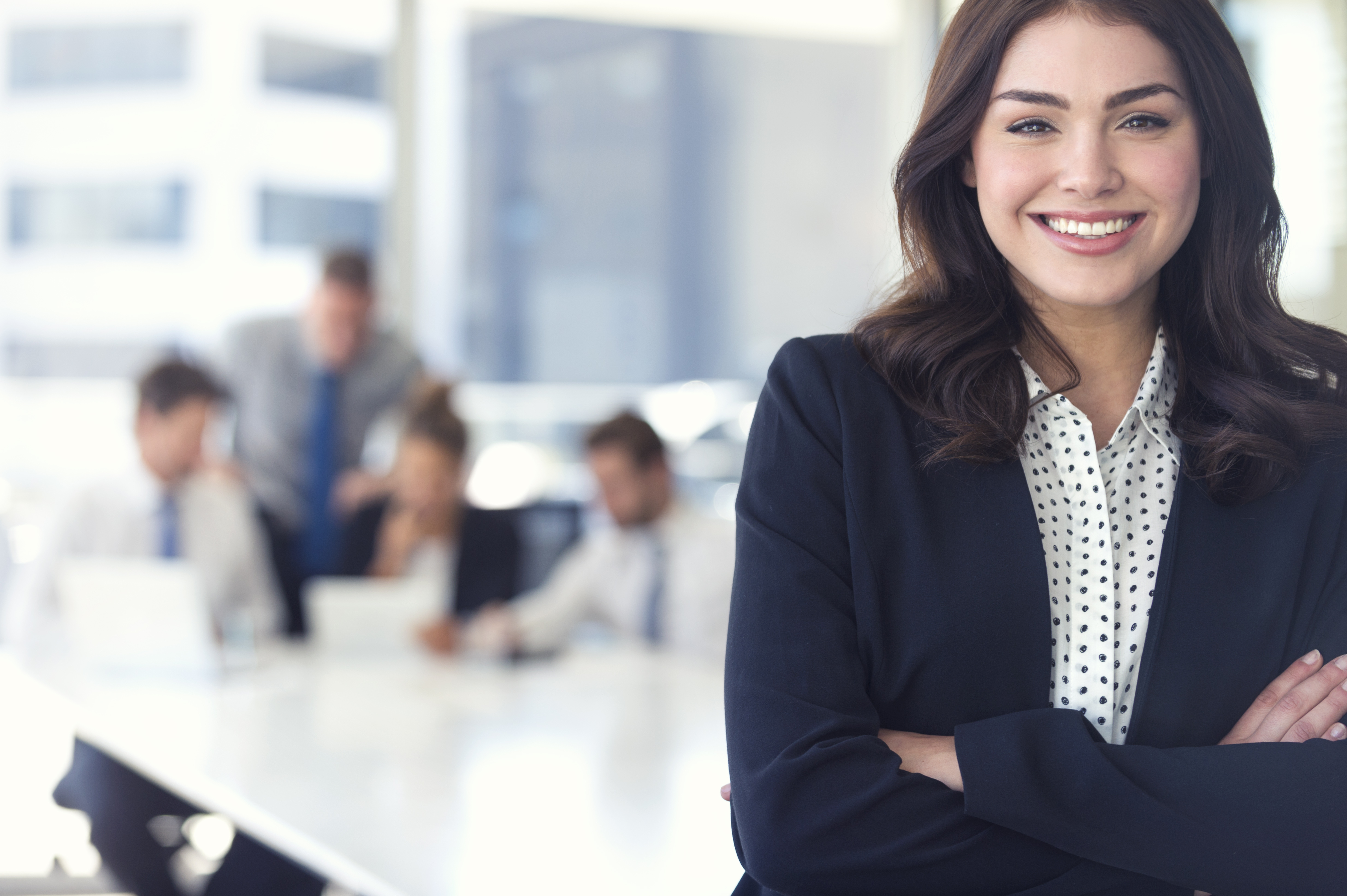 Woman in office boardroom smiling