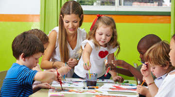 children painting in classroom